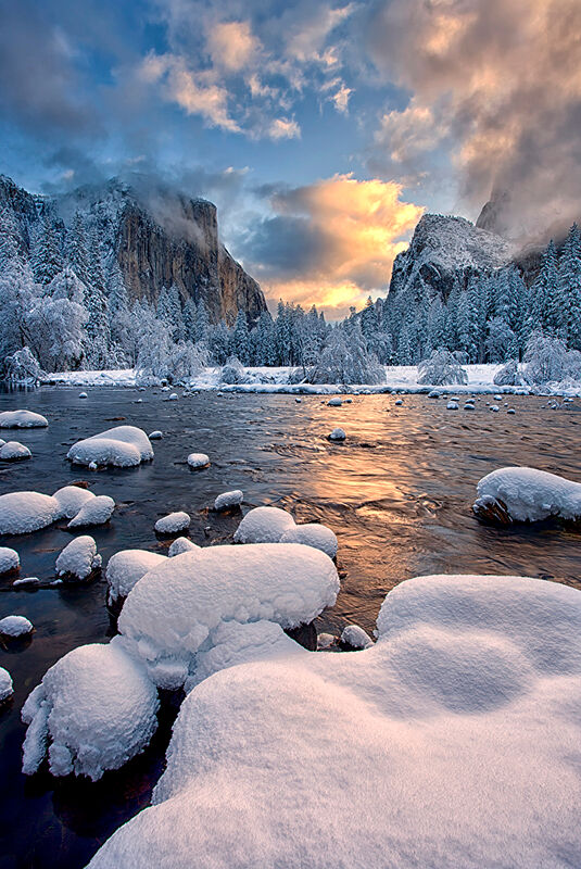 The first light of the morning illuminates Yosemite Valley after a clearing winter storm.